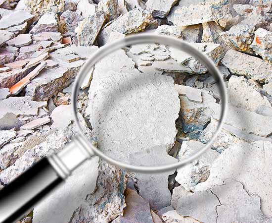 Magnifying glass showing asbestos