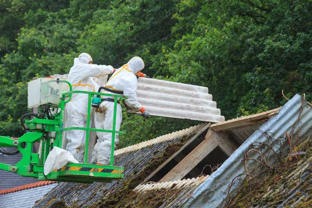 Asbestos men removing sheet